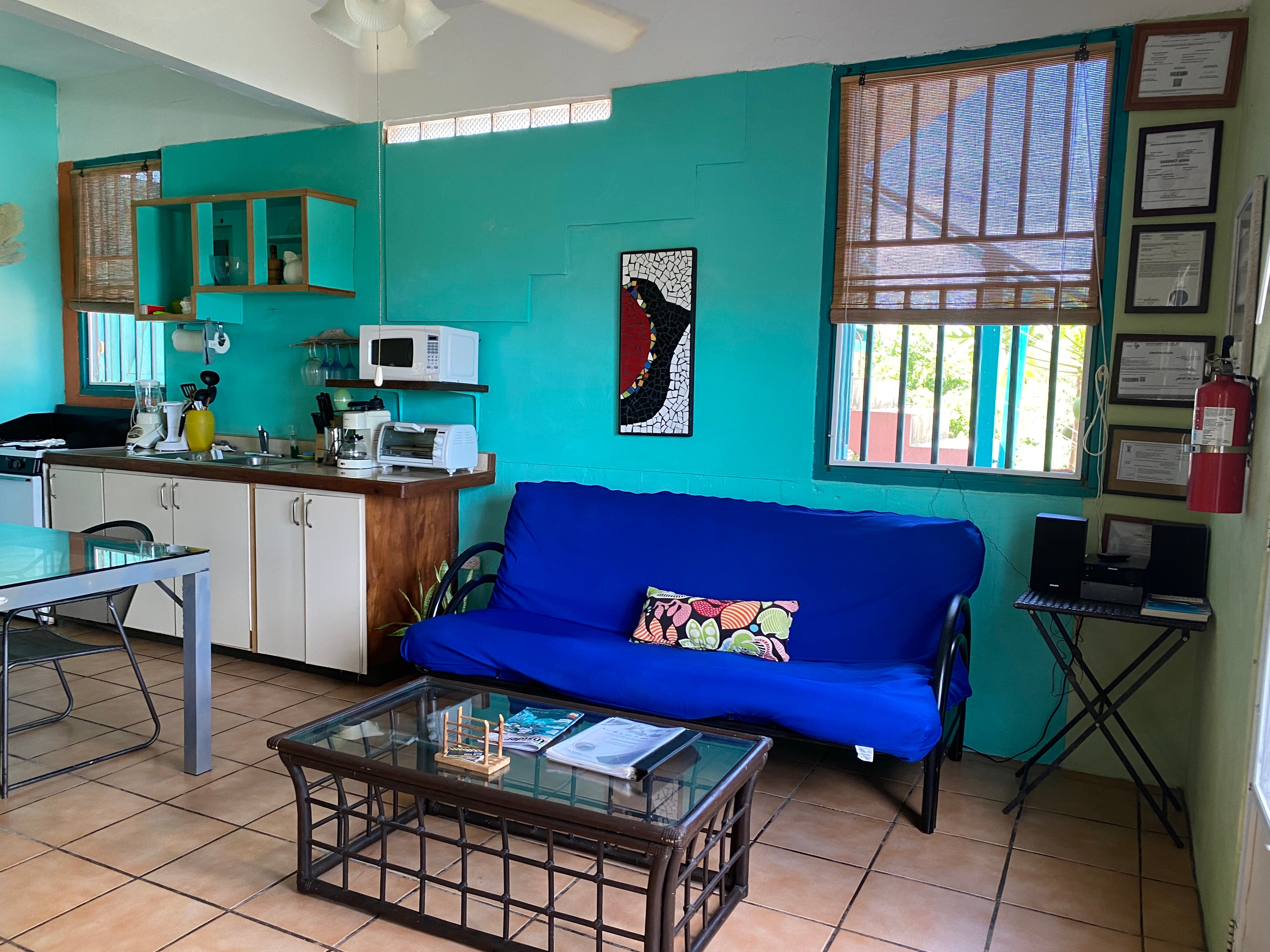 Gaviota loft studio with teal walls and kitchen
