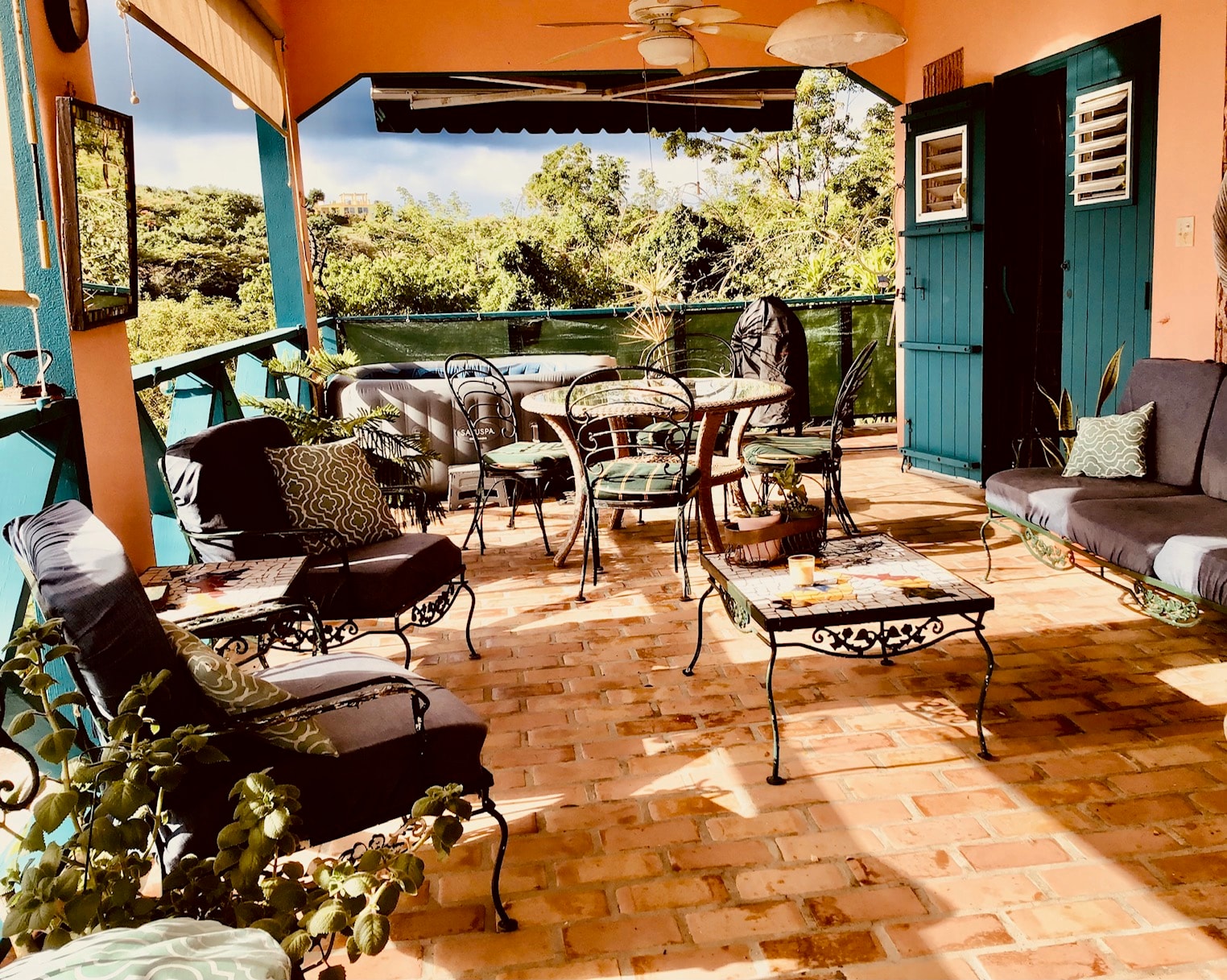 The Nest terrace with ceiling fan and garden views
